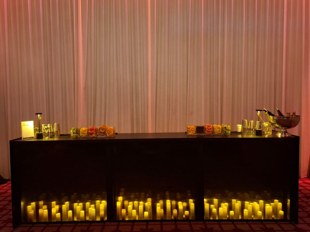 Dark Yaya mobile bar styled with candlelight at an event.