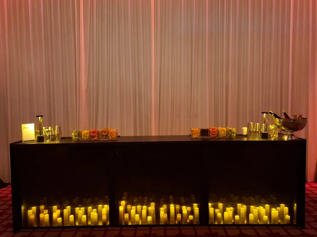 Dark Yaya mobile bar styled with candlelight at an event.
